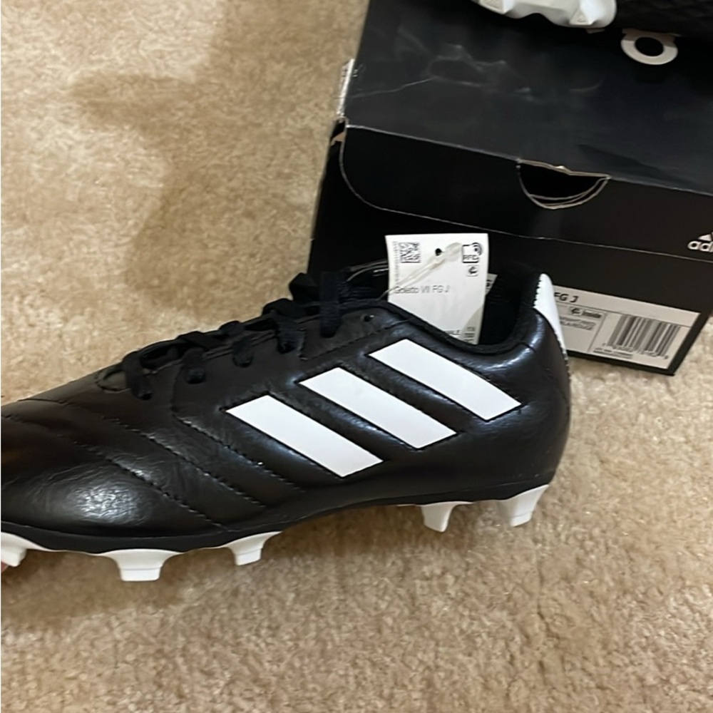 Brand new adidas soccer/football cleets. Size 4